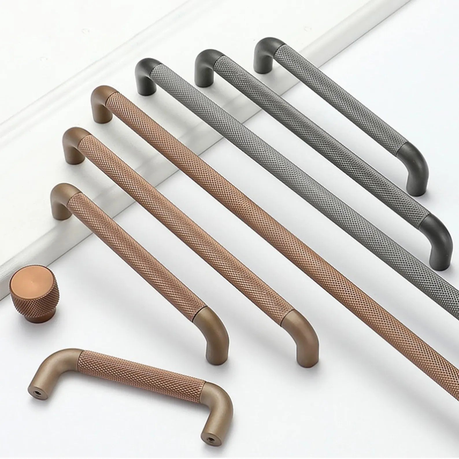 Brass Essence textured zinc alloy bar and knob handle set with modern industrial style, featuring sleek metallic finish.