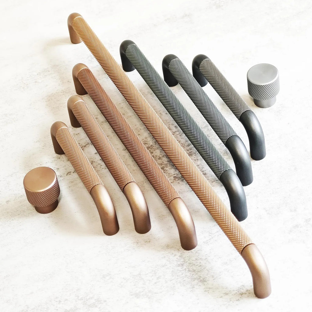 Brass Essence textured zinc alloy bar and knob handle set with modern industrial design, featuring sleek, durable hardware for furniture.