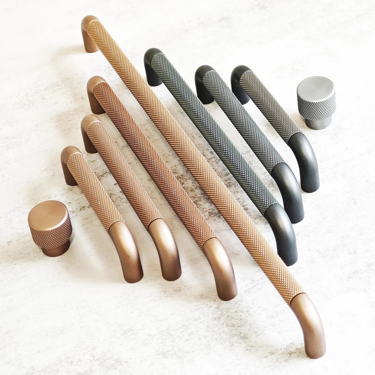 Brass Essence textured zinc alloy bar and knob handle set with modern industrial design, featuring sleek, durable hardware for furniture.
