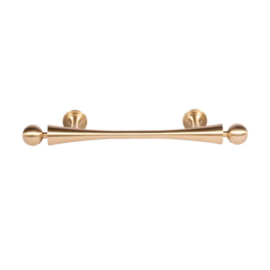 Brass Essence Seasaw Hourglass brushed brass cabinet handle mounted on a cabinet door with a sleek, modern design.