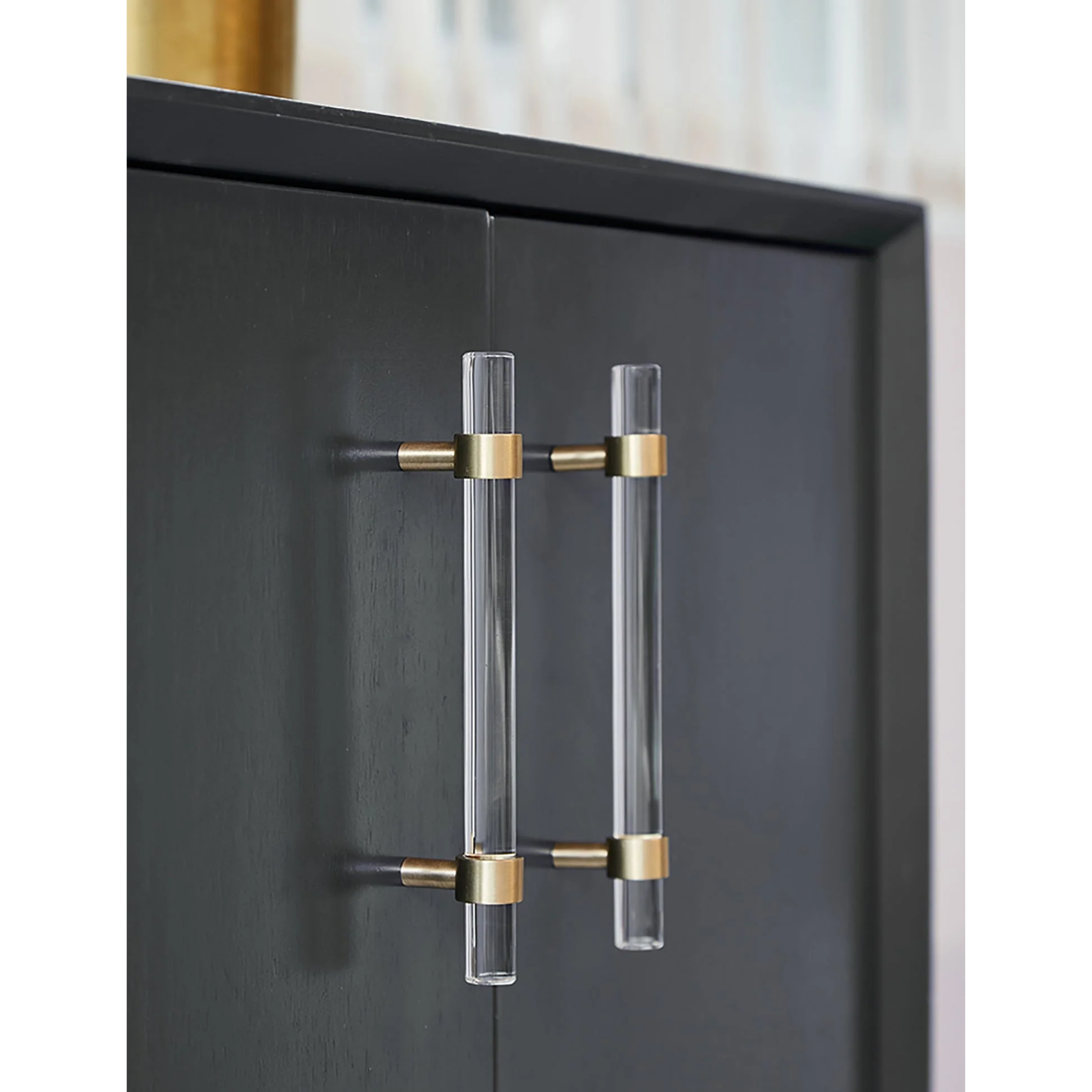 Clear acrylic and brass T-bar handle from Brass Essence collection, showcasing sleek, modern hardware with polished finish.