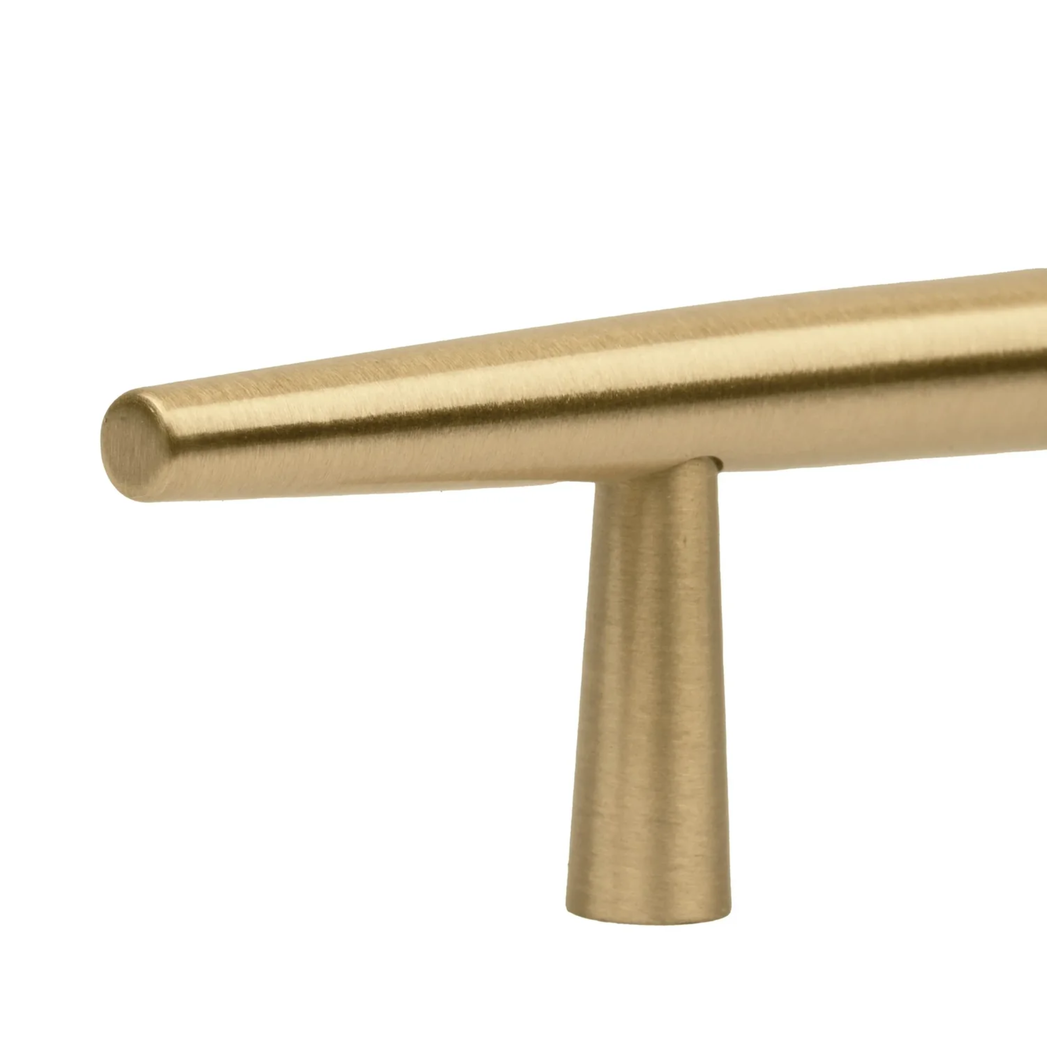 Brass Essence tapered brass spindle cabinet pull mounted on a cabinet door, showcasing its sleek, polished finish and ergonomic design.