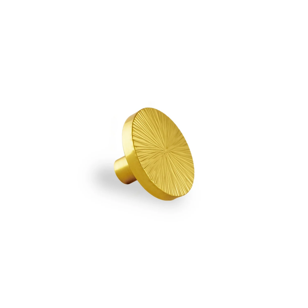 Hammered Sunburst Brass Cabinet Knob by Brass Essence, close-up of the textured brass surface and sunburst design.