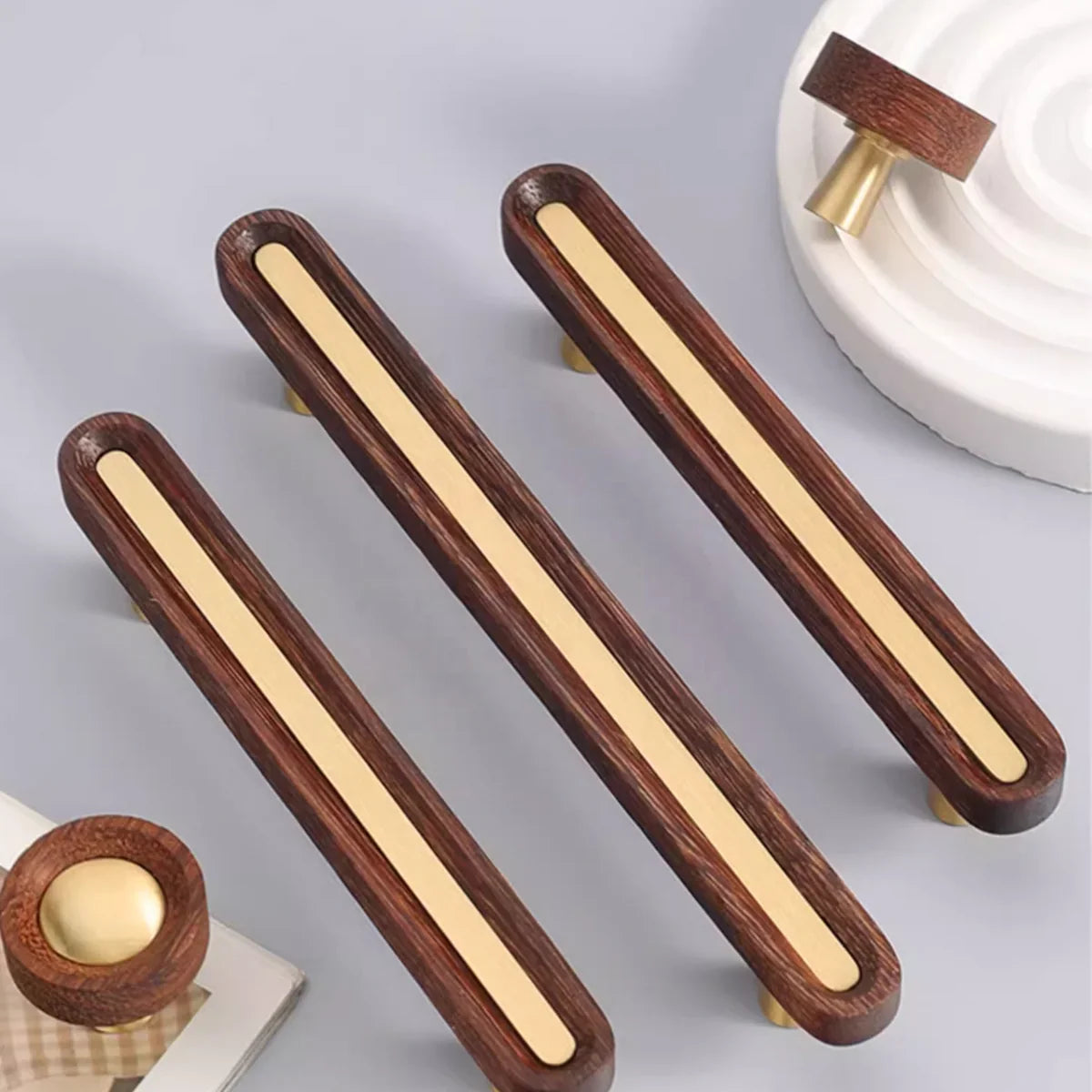 Brushed brass and wenge wood handle by Brass Essence, showcasing sleek, modern design with a polished brass finish and dark wood accents.