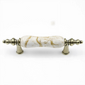 Antique ceramic and zinc cabinet pulls by Brass Essence, featuring detailed ceramic handles with zinc backing, perfect for vintage furniture.