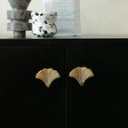 Glossy gold Ginkgo leaf solid brass cabinet knobs in 50 mm and 65 mm by Brass Essence