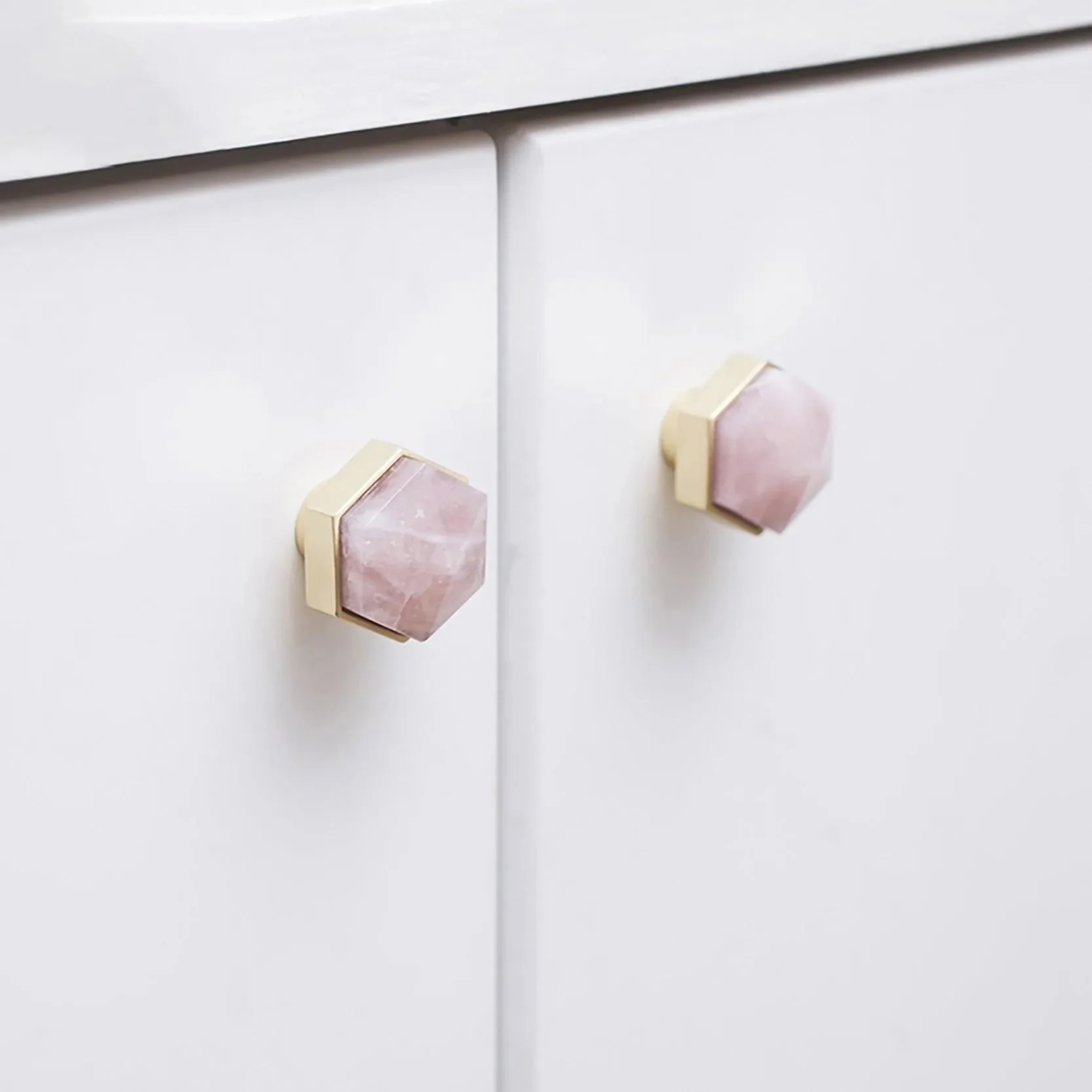 Brass Essence natural crystal and brass hexagon knob, featuring a polished crystal handle and brass geometric base, for furniture decor.