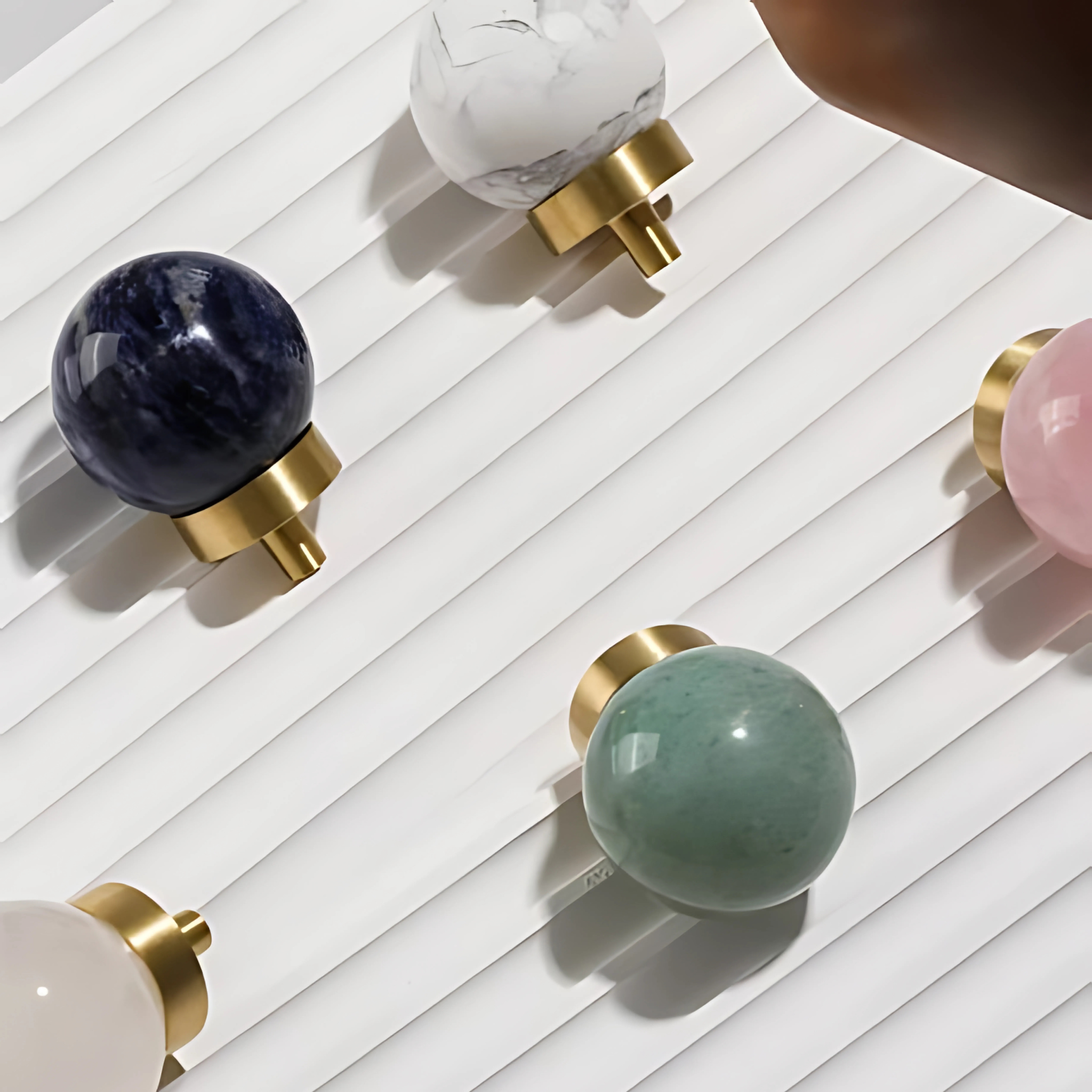 Natural crystal ball and brass cabinet knob from Brass Essence, featuring a clear glass sphere and elegant brass finish.