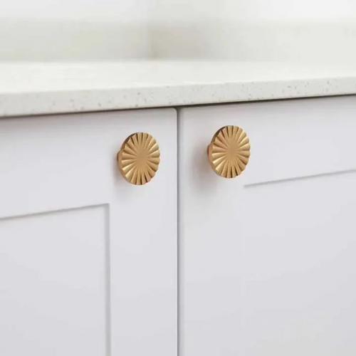 Brass essence Cherry Blossom Sunburst Brass Knob with intricate floral design, shiny brass finish, ideal for cabinet or drawer hardware.