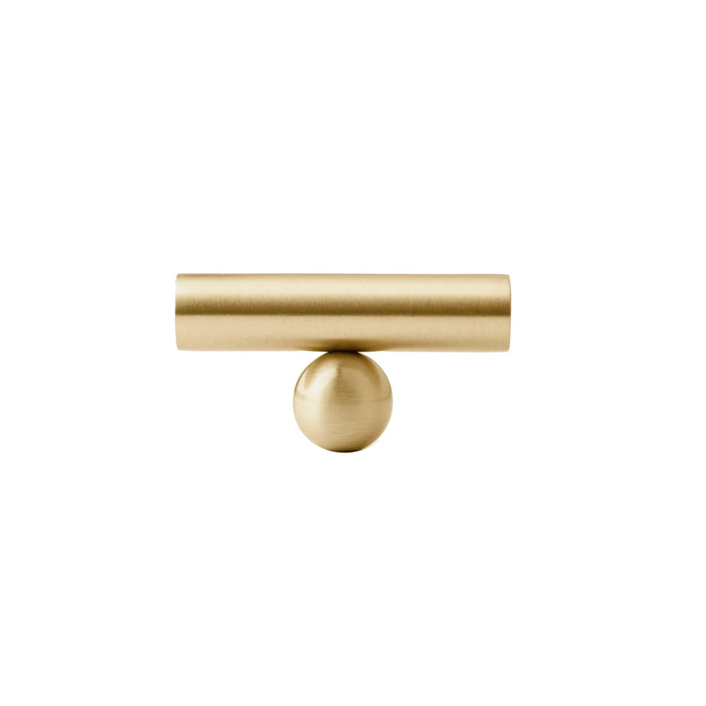 Solid brass goblet cabinet handle from Brass Essence collection, featuring a polished brass finish and ergonomic design.