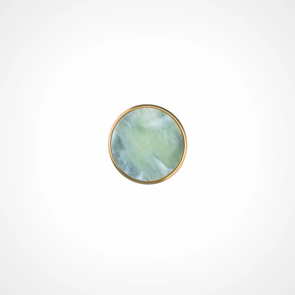 Acrylic and brass disc cabinet knob by Brass Essence, featuring a sleek round design with a shiny brass finish.