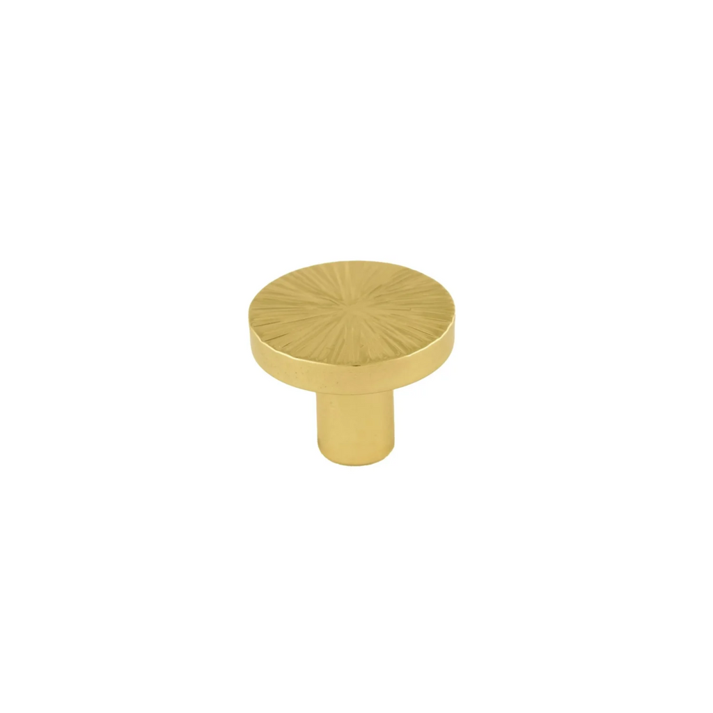Hammered Sunburst Brass Cabinet Knob by Brass Essence, close-up showing textured brass surface and elegant round shape.