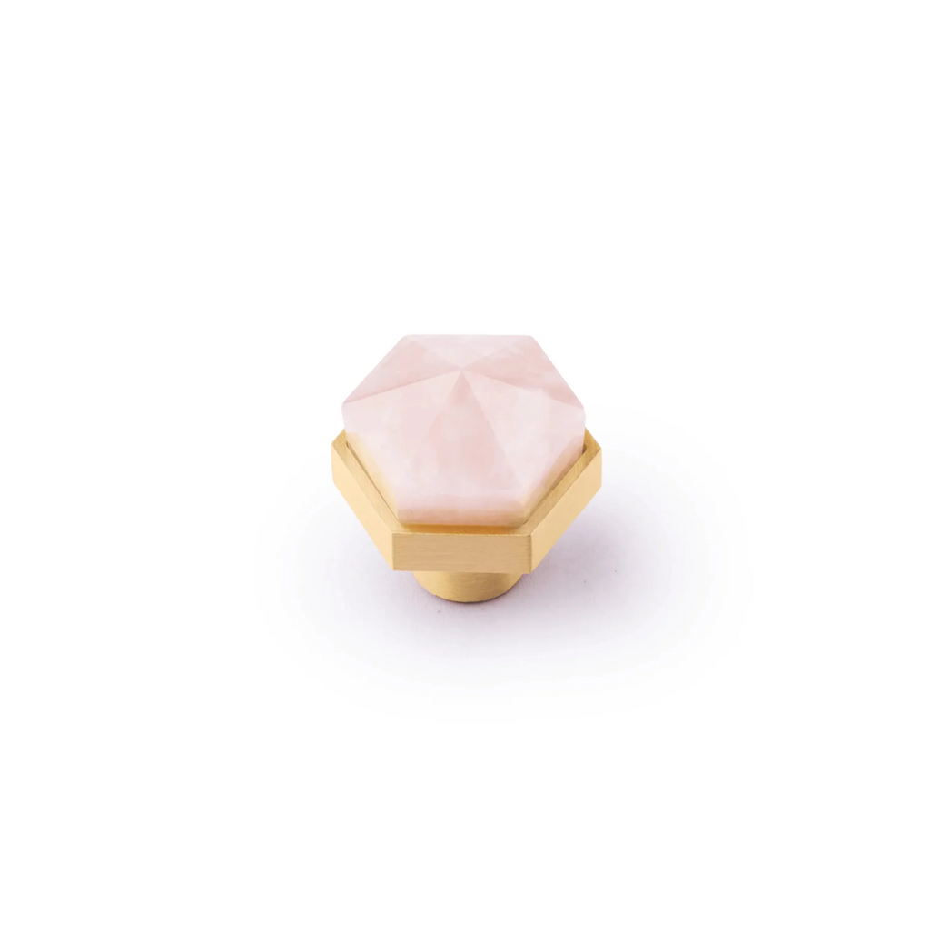Natural crystal and brass hexagon knob from Brass Essence, showcasing a polished crystal sphere with brass hexagon base.
