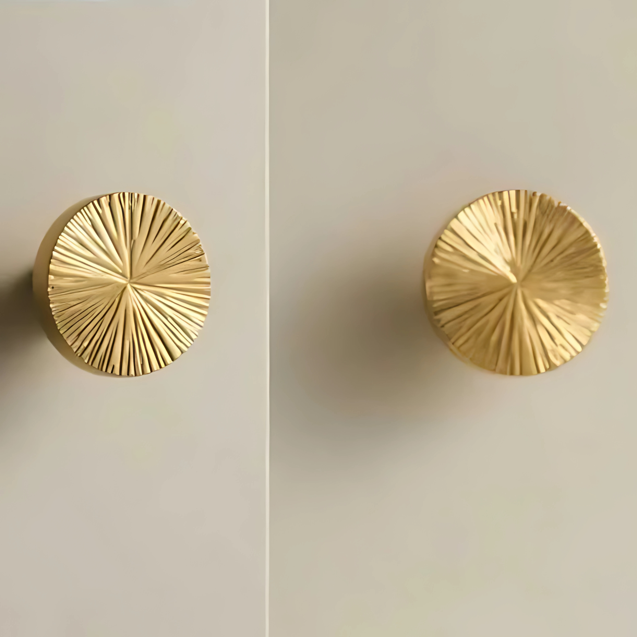 Brass Essence hammered sunburst brass cabinet knob with textured finish, decorative hardware for furniture or cabinetry.