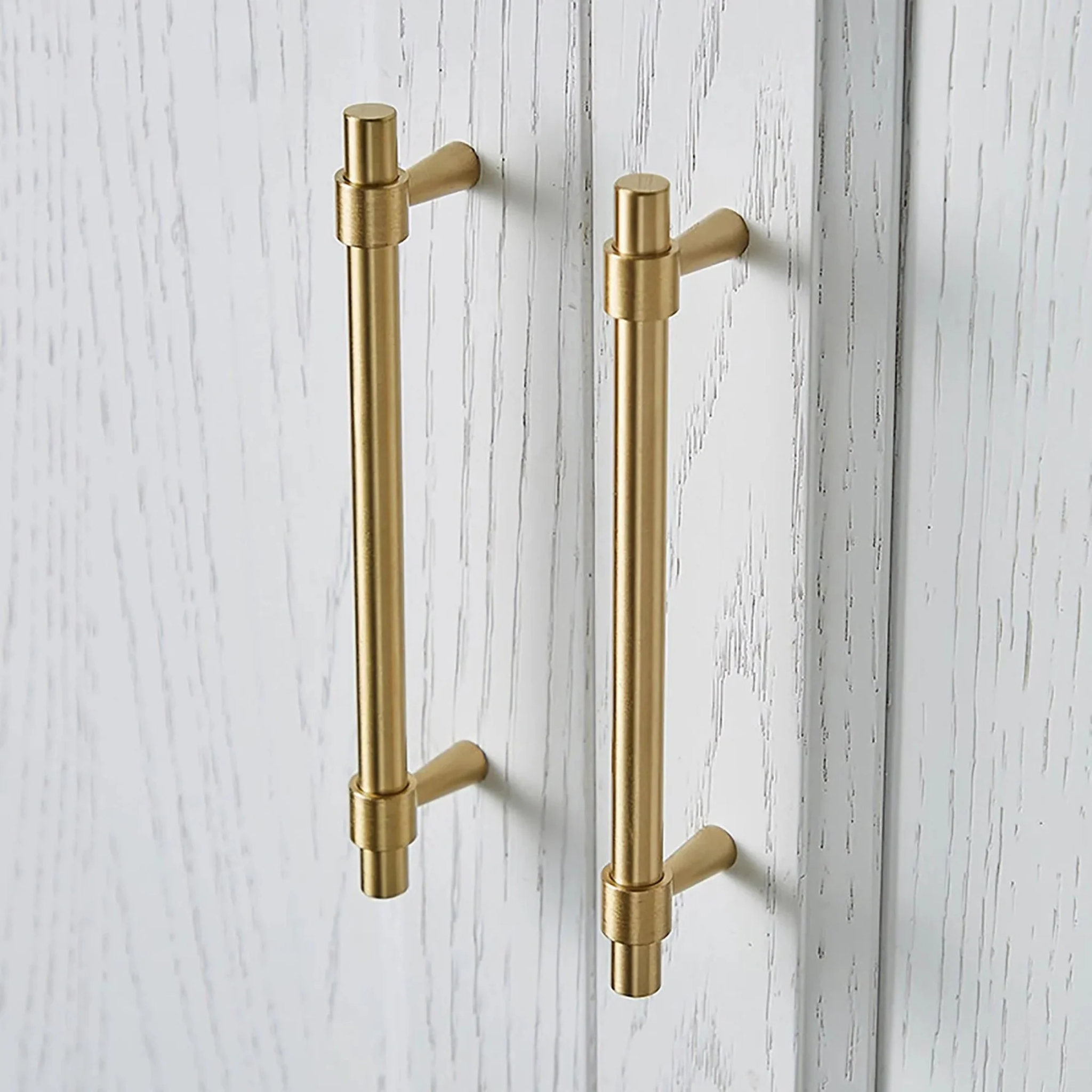 Brass Essence Naveena solid brass T-bar handle from the collection, showcasing a sleek, polished brass finish and sturdy design.