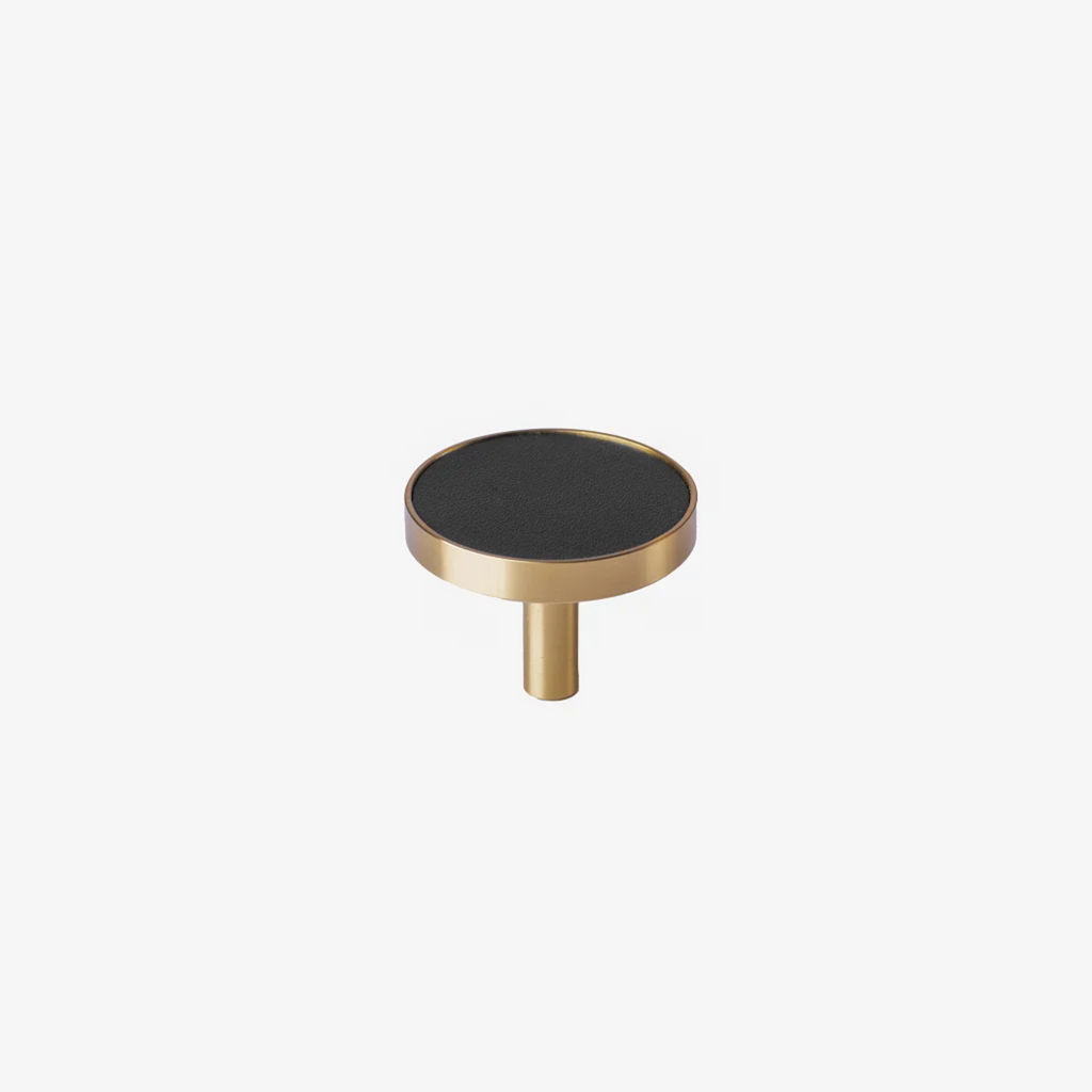 Brass essence brushed brass and leather round handle with a sleek, polished design suitable for furniture or doors.
