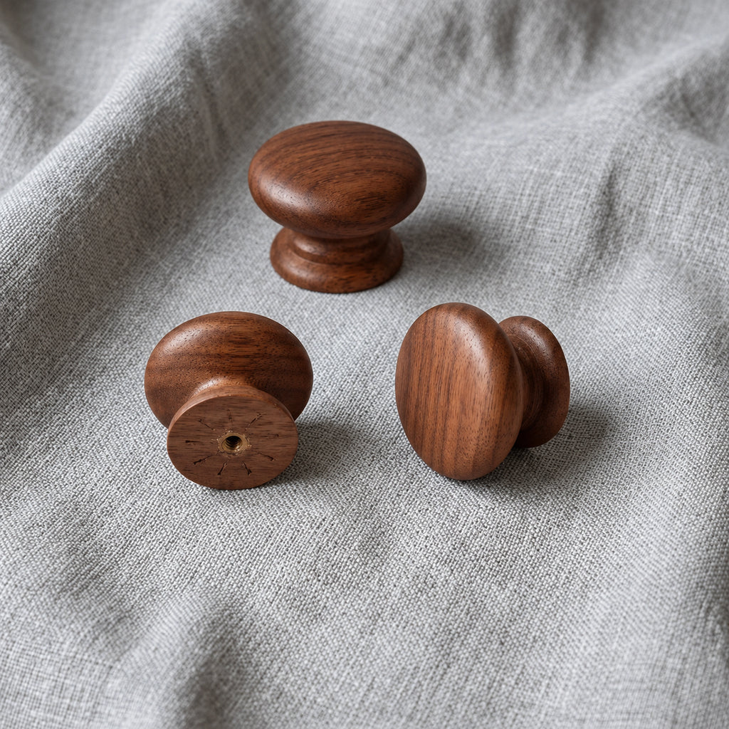 Tectona walnut wooden cabinet knobs on grey fabric showing front, side and rear views – Brass Essence