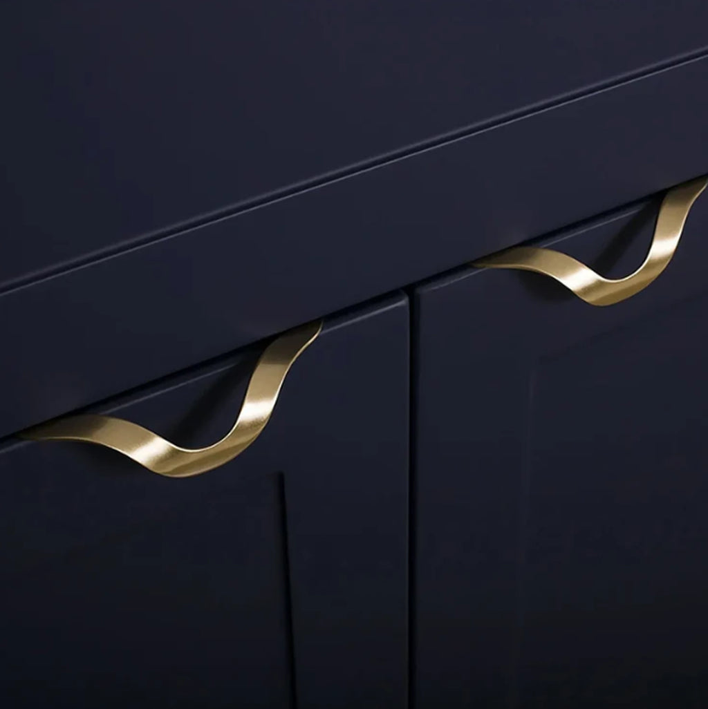 Front view of Brass Essence gold-tone wave kitchen drawer profile handle
